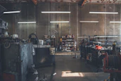 High-end mechanical tools and equipment set in a minimalist industrial style garage.