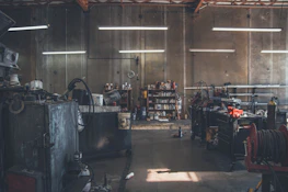 High-end mechanical tools and equipment set in a minimalist industrial style garage.