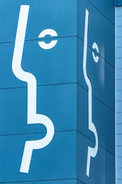 a blue building with white lines painted on it