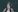 selective focus photography of woman near green grass plant at daytime