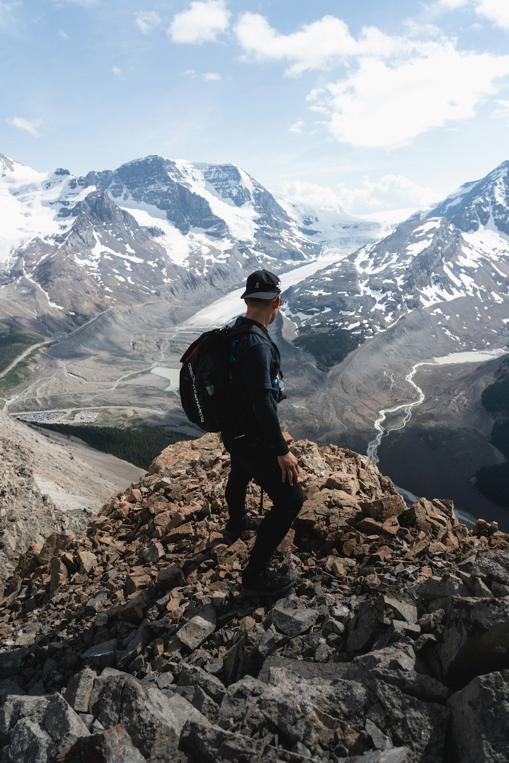 man standing on rock mountain