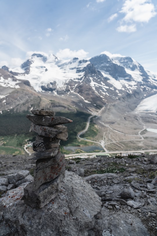 rock balancing during daytime in Jasper National Park Of Canada Canada