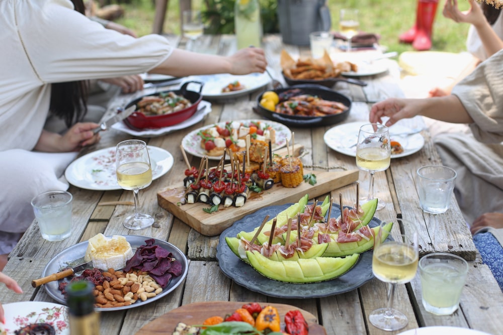 group of people eating on backyard