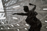 A vibrant bronze sculpture capturing dynamic movement.