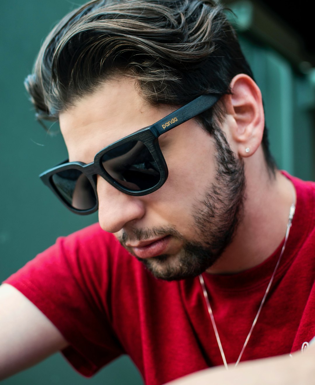 man wearing black sunglasses and red shirt