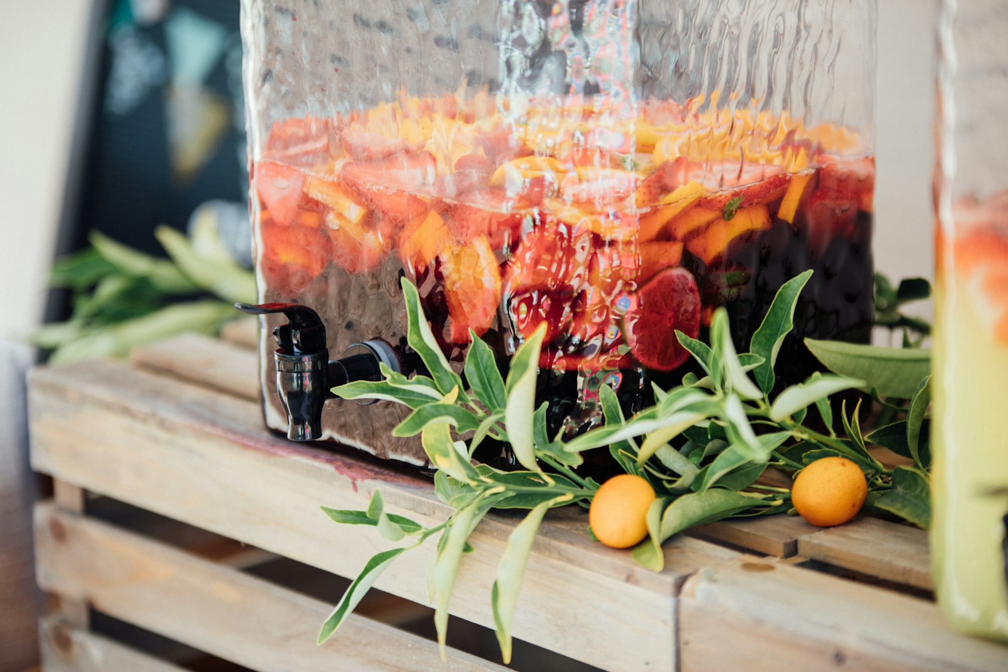 Large drink dispenser filled with sangria for summer party