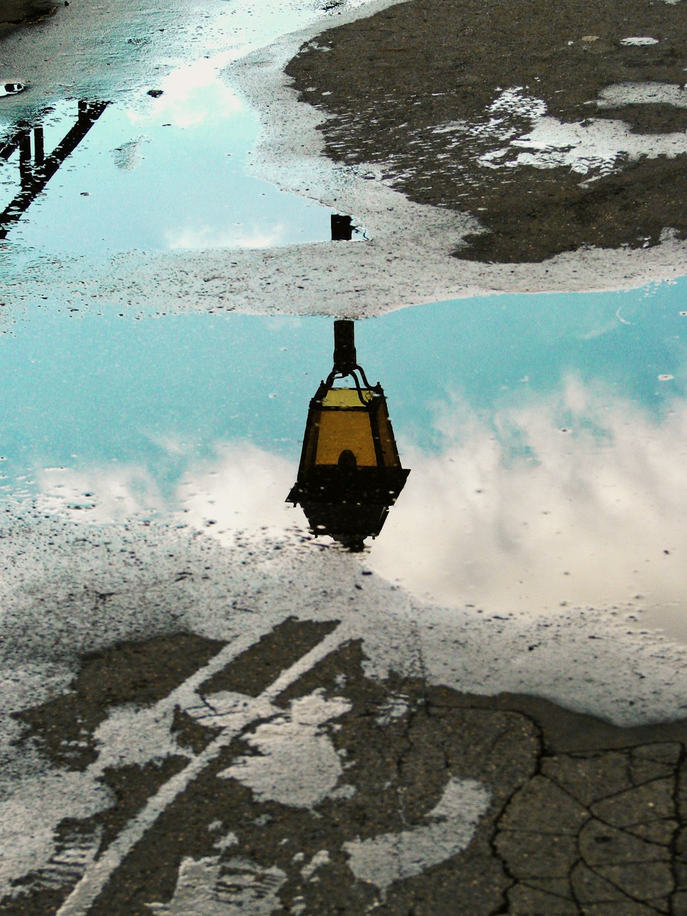 water mirror photography of street post