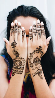 woman covering her face with her two hands