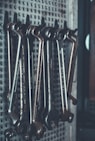 close-up photo of gray combination wrench set