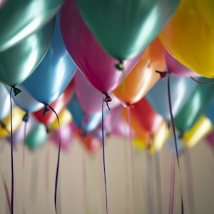 selective focus photography of assorted-color balloons