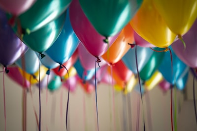 selective focus photography of assorted-color balloons party google meet background