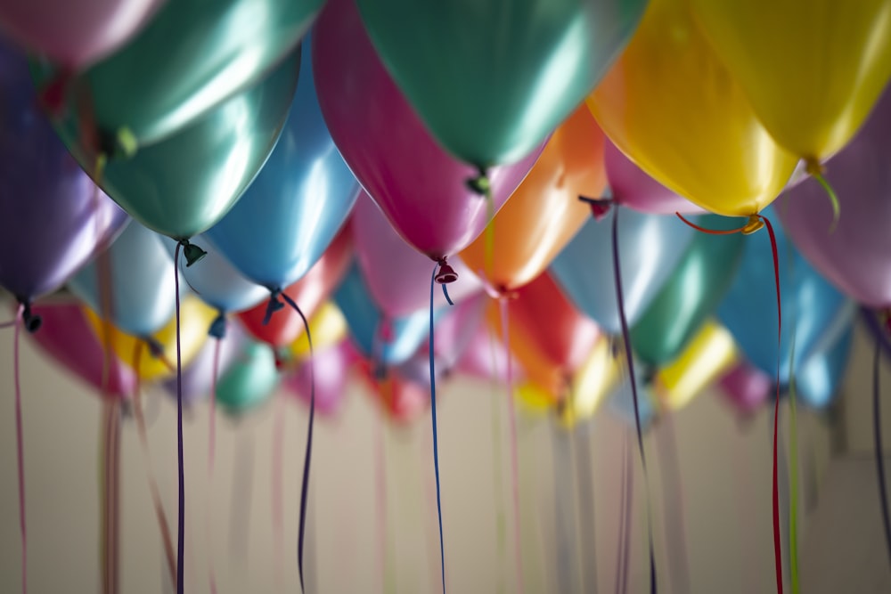 selective focus photography of assorted-color balloons