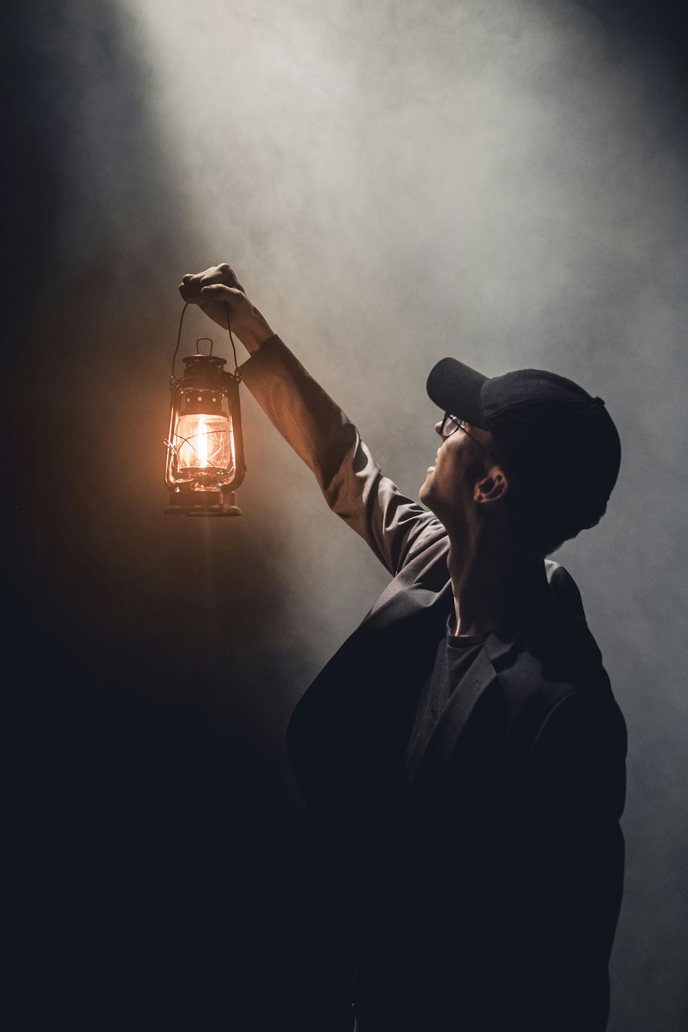 man holding lighted gas lantern photo – Free People Image on Unsplash