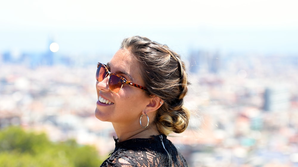 selective focus photography of woman smiling during daytime