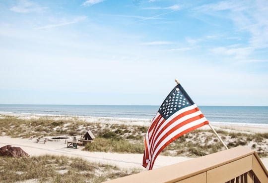 US flag attached on building at daytime in Jacksonville United States