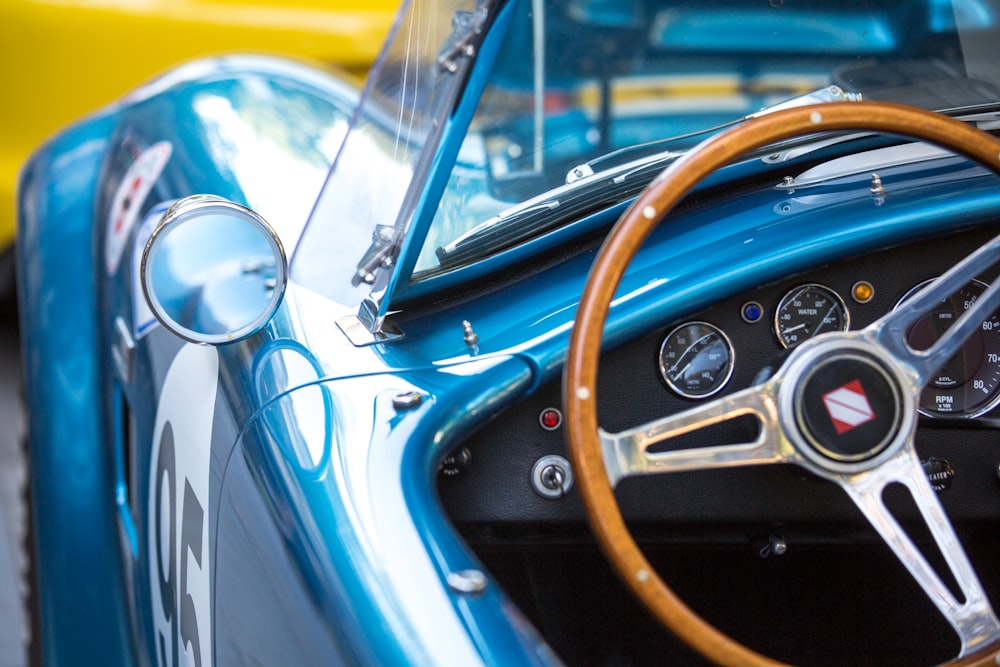 shallow focus photo of car steering wheel