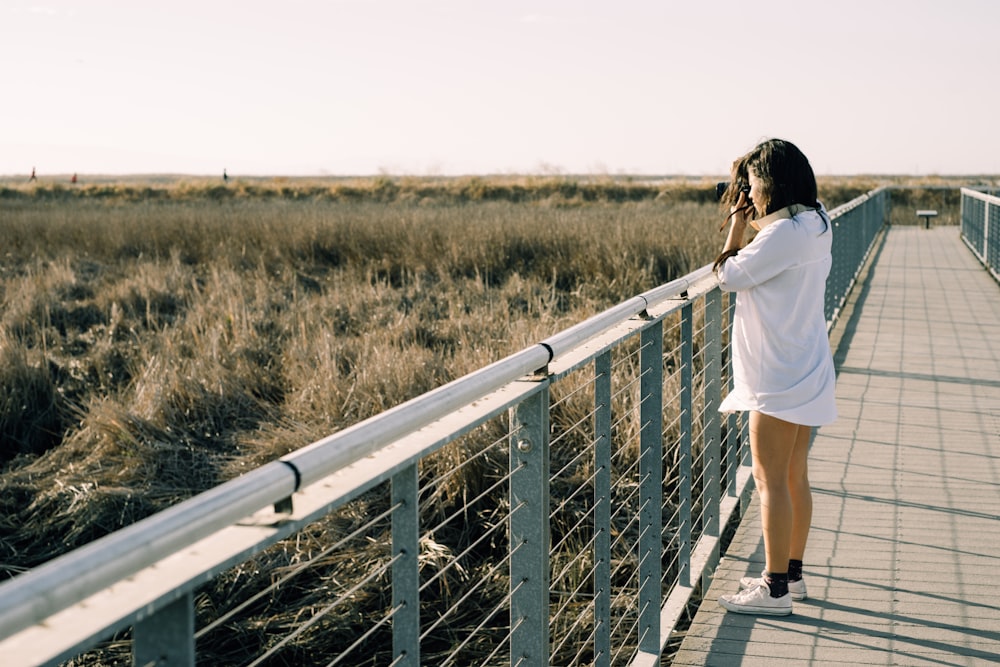 woman taking landscape photoraphy