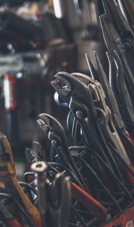 selective focus photography of mechanics tool lot