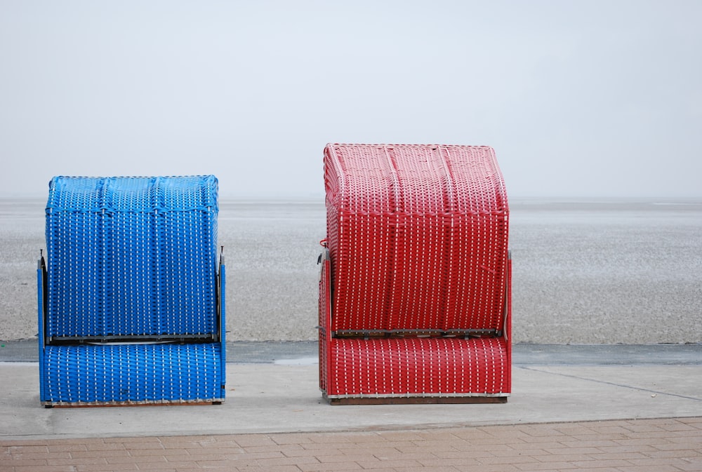 red and blue leather bags on gray surface