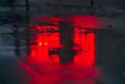 puddle on ground red teams background