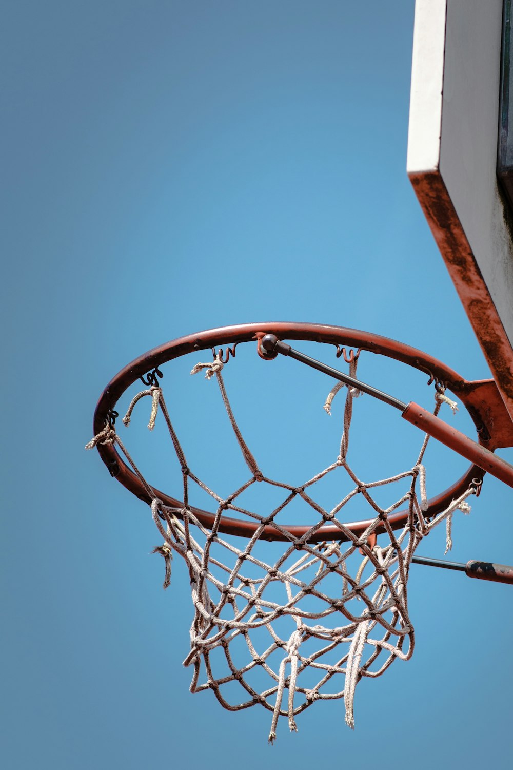 low angle photography of red and white basketball system