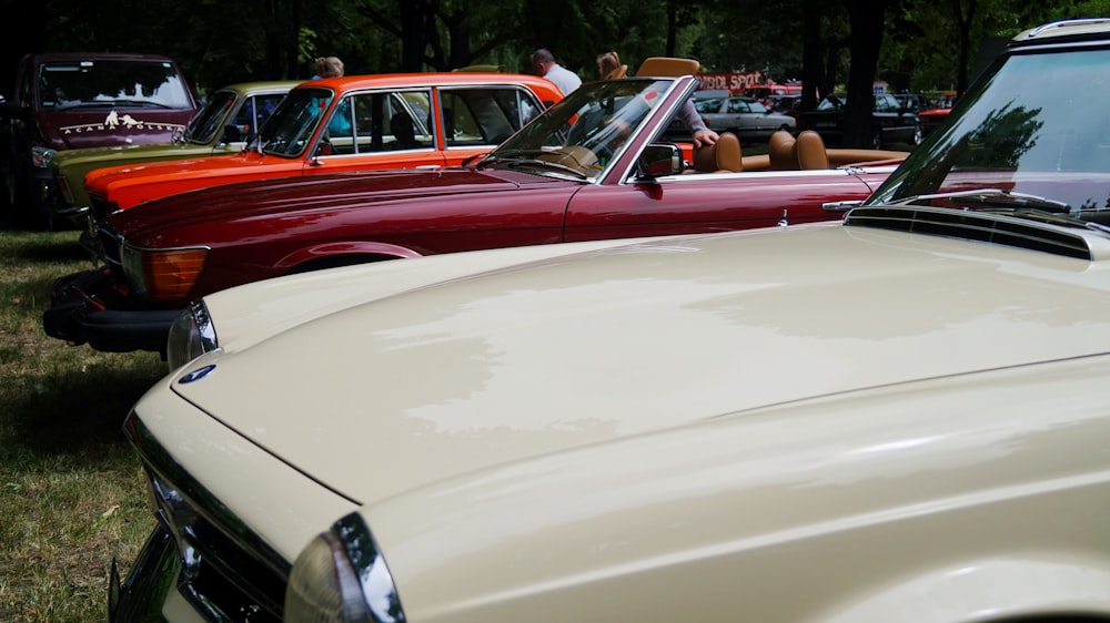 white car beside red car