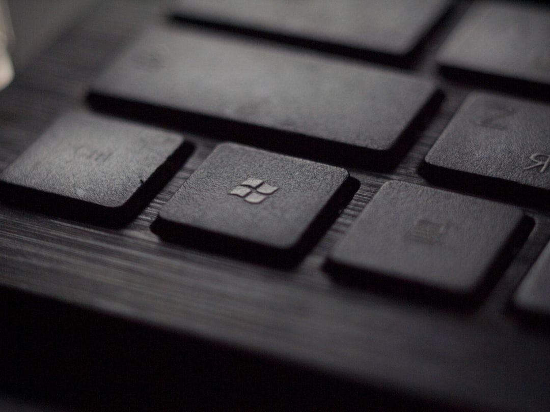 Up close pic of Microsoft button on keyboard. 