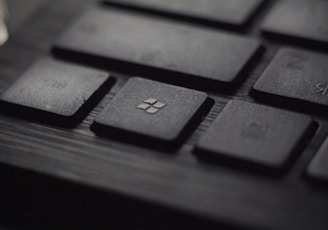 black laptop computer keyboard in closeup photo