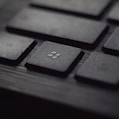 black laptop computer keyboard in closeup photo