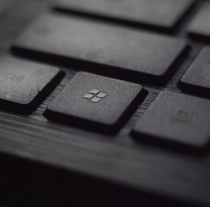 black laptop computer keyboard in closeup photo