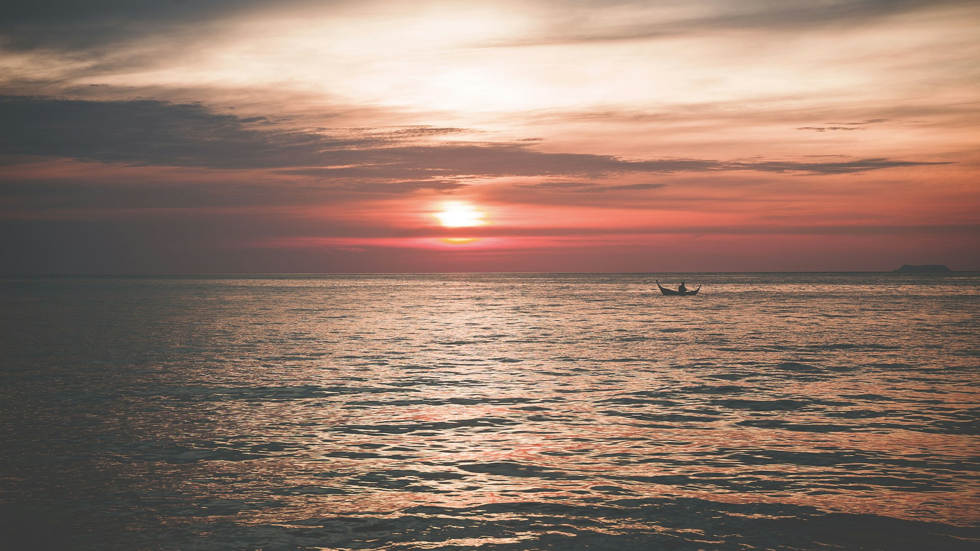 boat on sea during golden hour