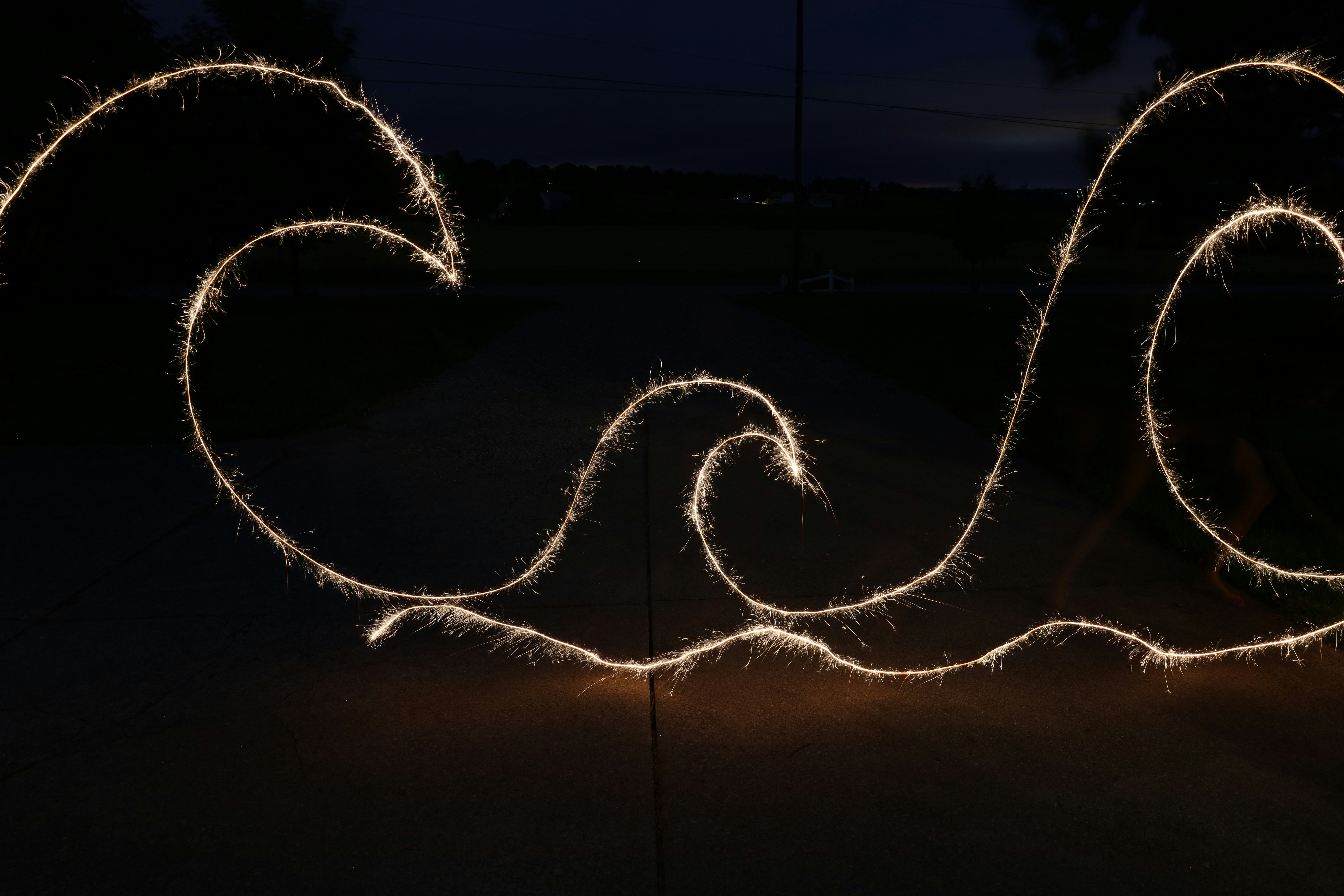 Sea wave string lights photo – Free Sparkler exposure Image on Unsplash