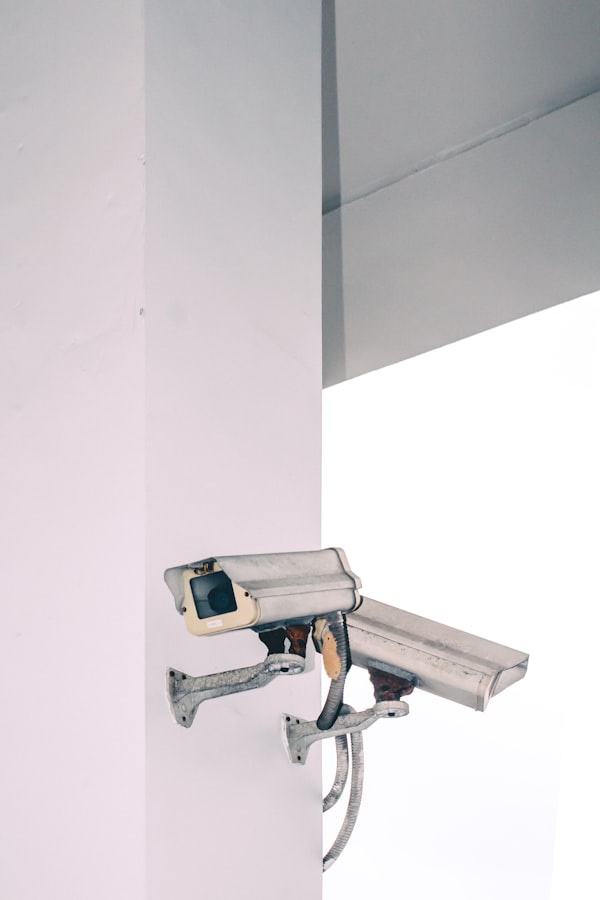 Two bullet security cameras attached to a wall