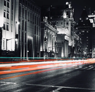 Evening cityscape of Guanajuato illuminated with red and white lights reflecting urgency and clarity.