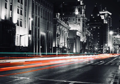 Evening cityscape of Guanajuato illuminated with red and white lights reflecting urgency and clarity.
