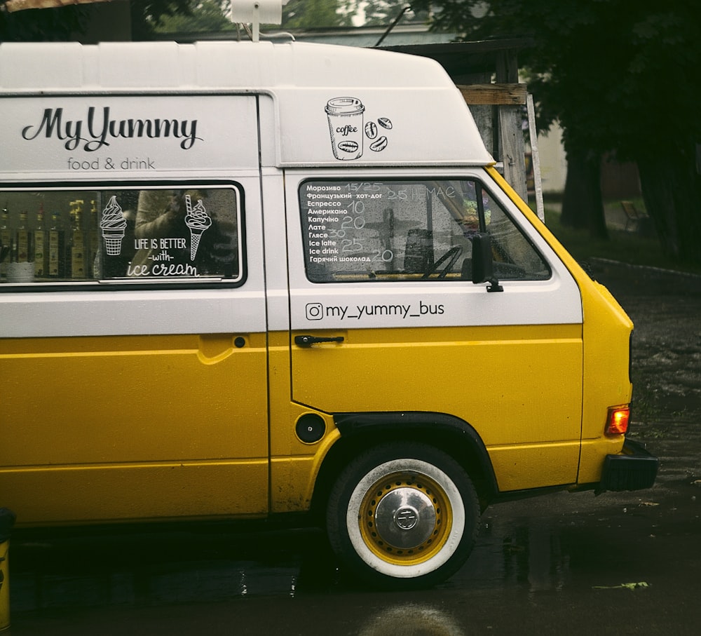 close-up photo of white and yellow food truck