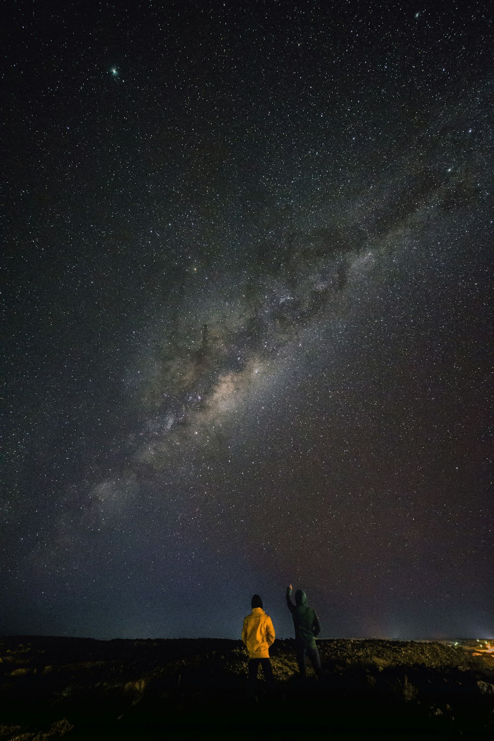 two person standing while watching sky