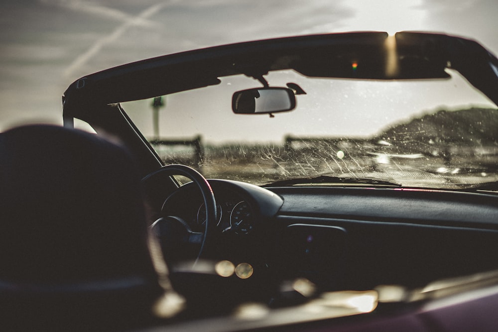 black coupe under gray sky