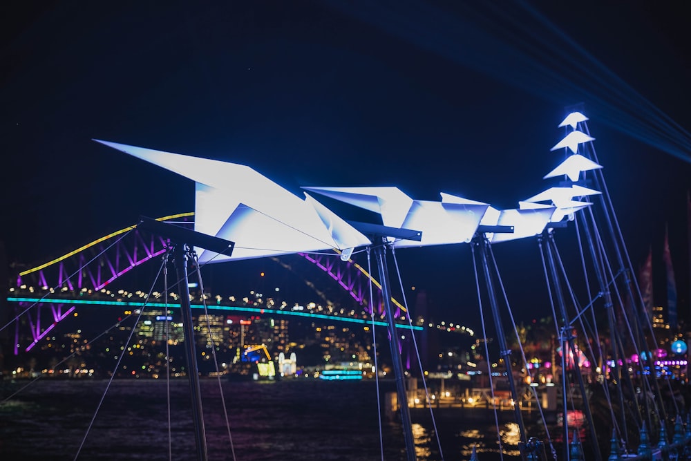 white planes sculpture with lights at night