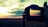 A photographer capturing a stunning landscape at sunset.