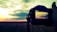 A photographer capturing a stunning landscape at sunset.
