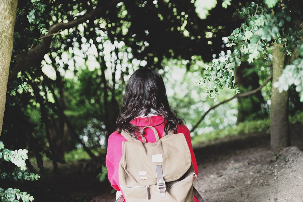 woman wearing brown backpack