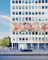 A vibrant mural depicting African American innovators in science and medicine from 1990 to 2026.