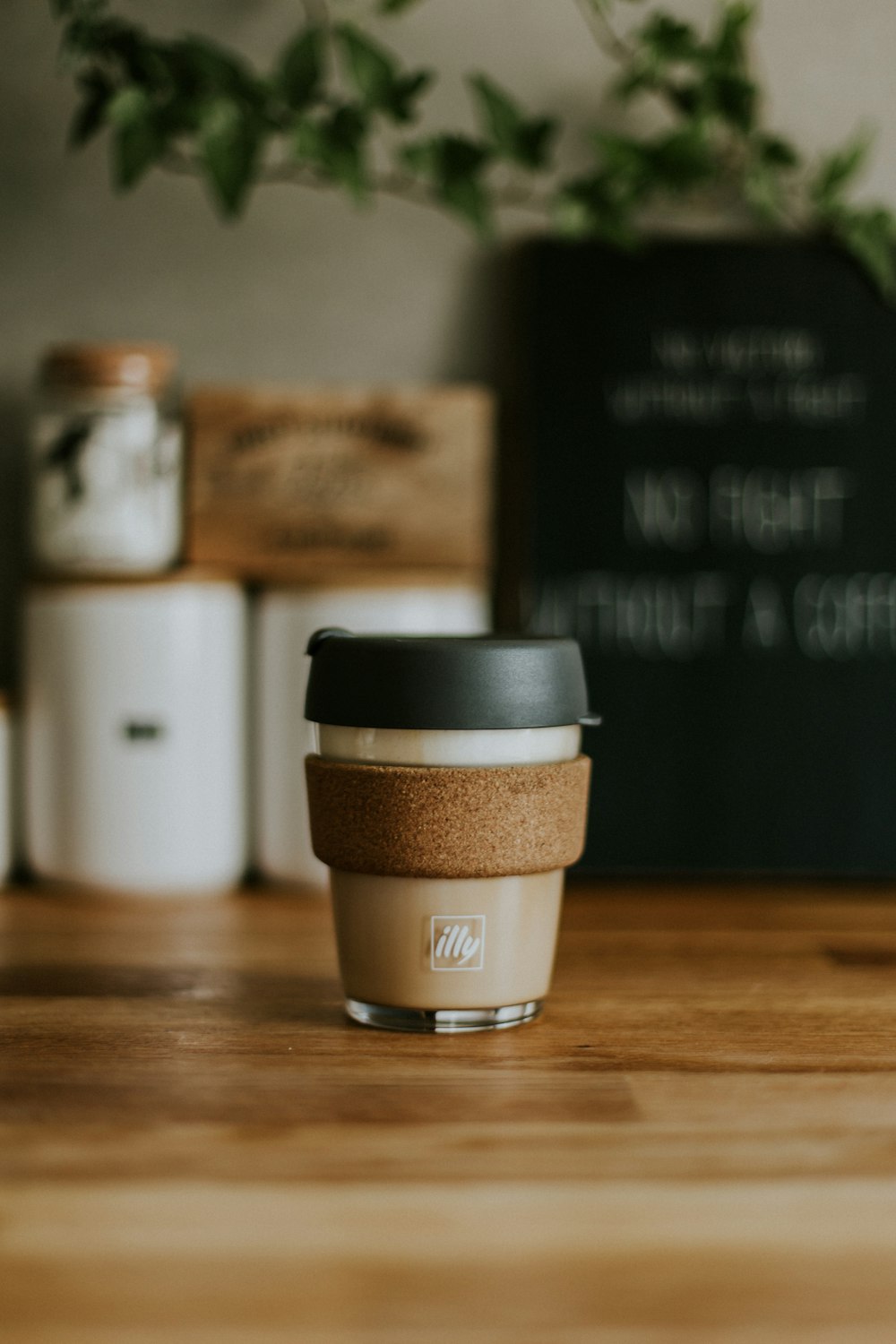 selective focus photography of brown Illy bottle on table