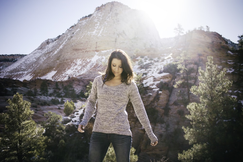 woman standing on front of mountain