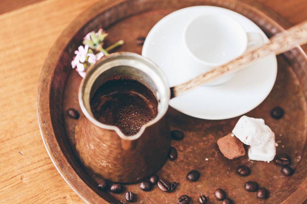 coffee on coffee pot with beans