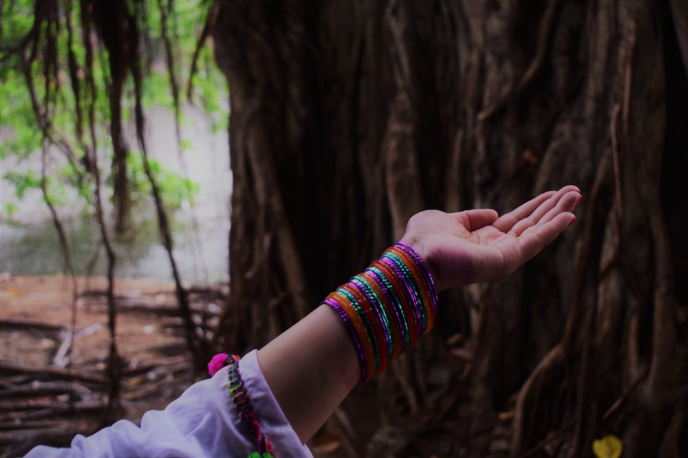 woman raising her hand upward opening her palm