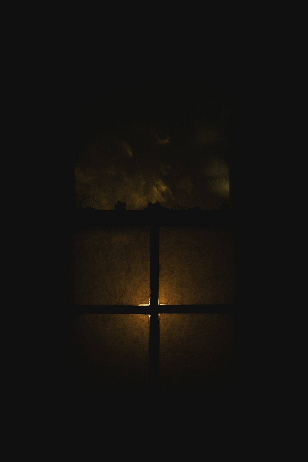 a window with a light shining through it