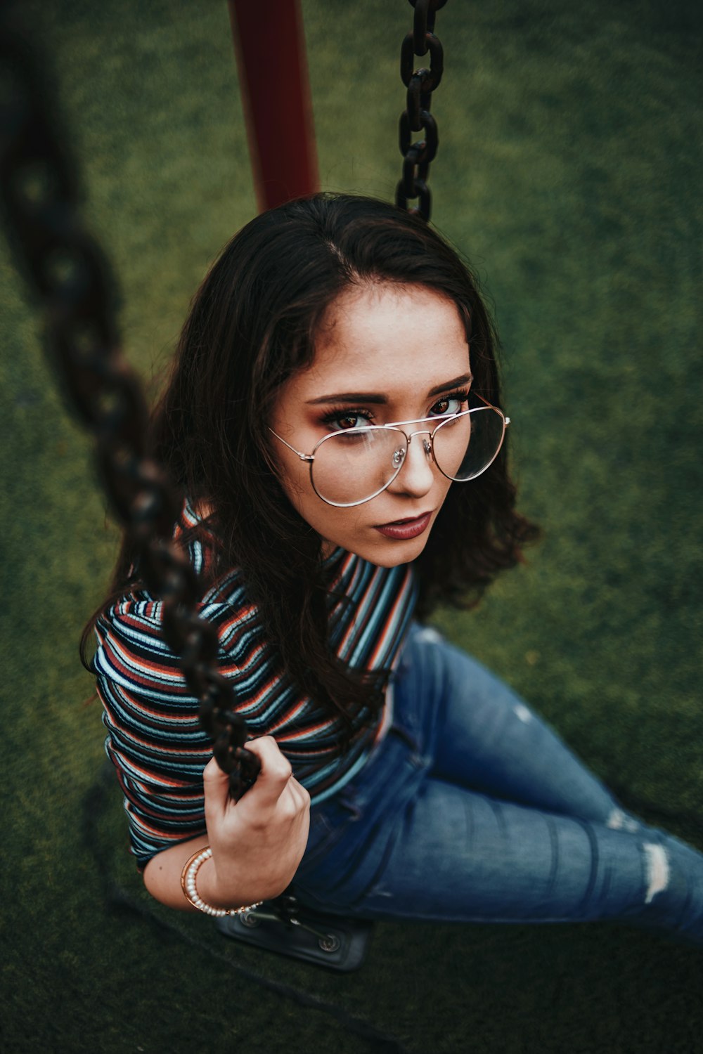 woman sitting on swing