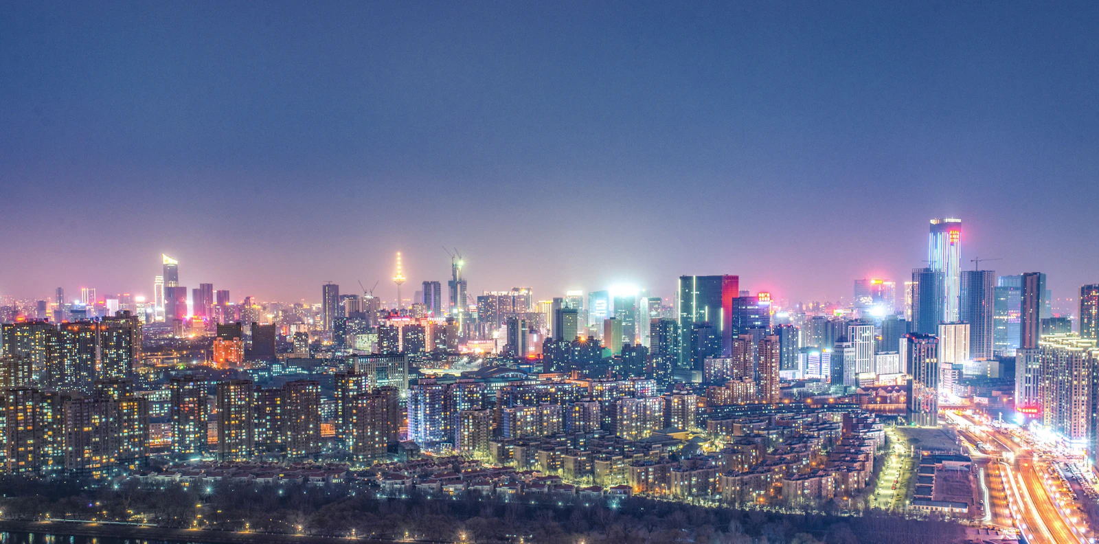 Aerial view of a city skyline at night